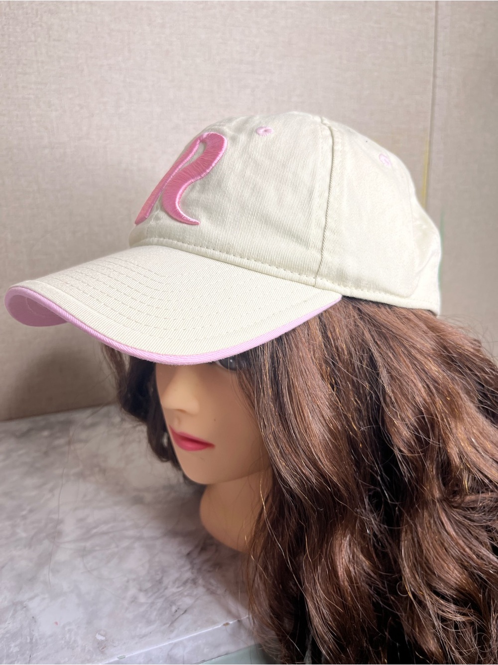 The Game adjustable pink cotton baseball cap with a curved brim and details